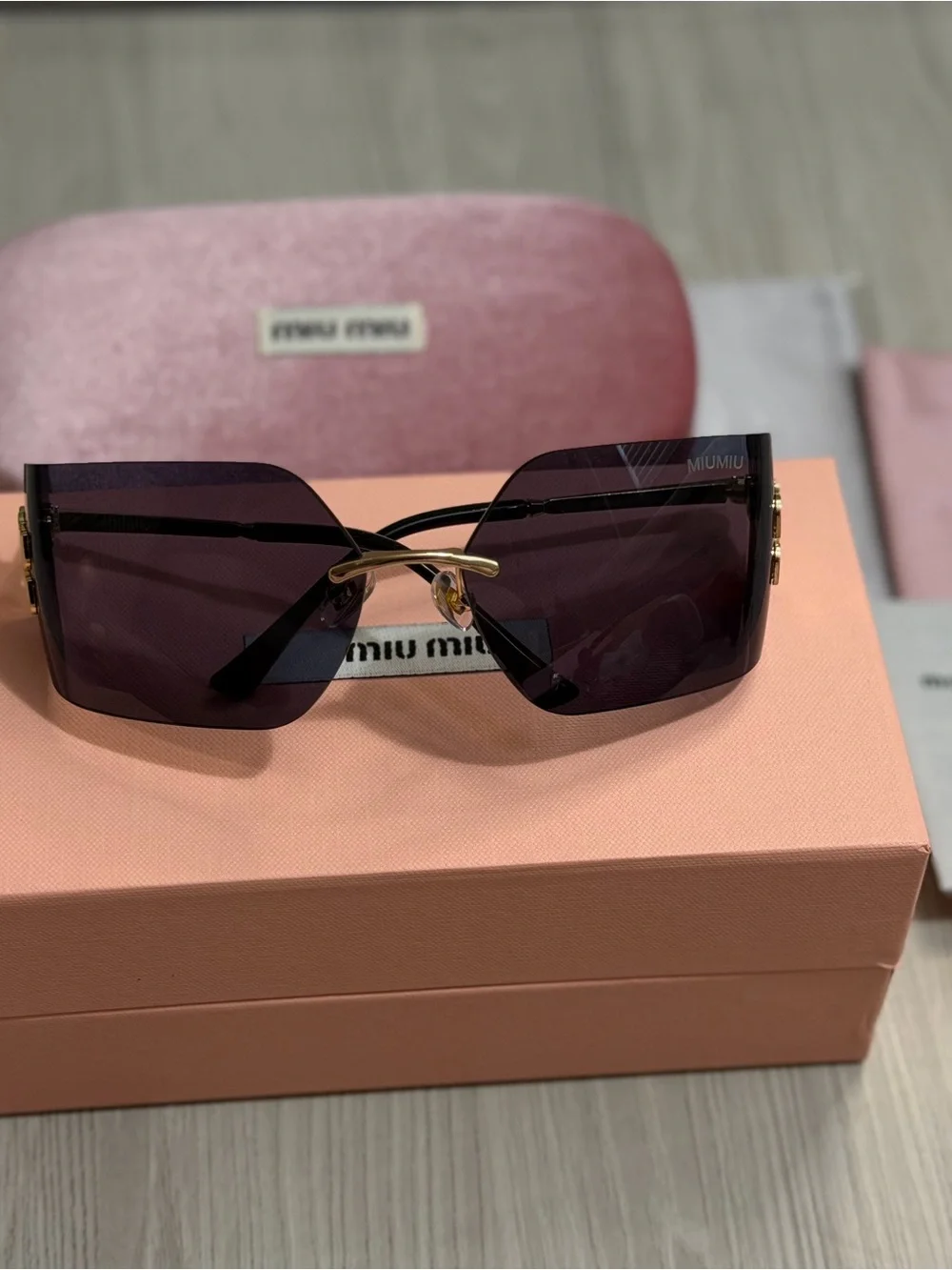 Miu Miu Purple Lens Frameless Sunglasses with Gold Accent